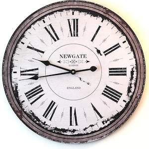 May include: A white and black vintage-style clock with Roman numerals and a distressed finish. The clock face reads "Newgate London England".