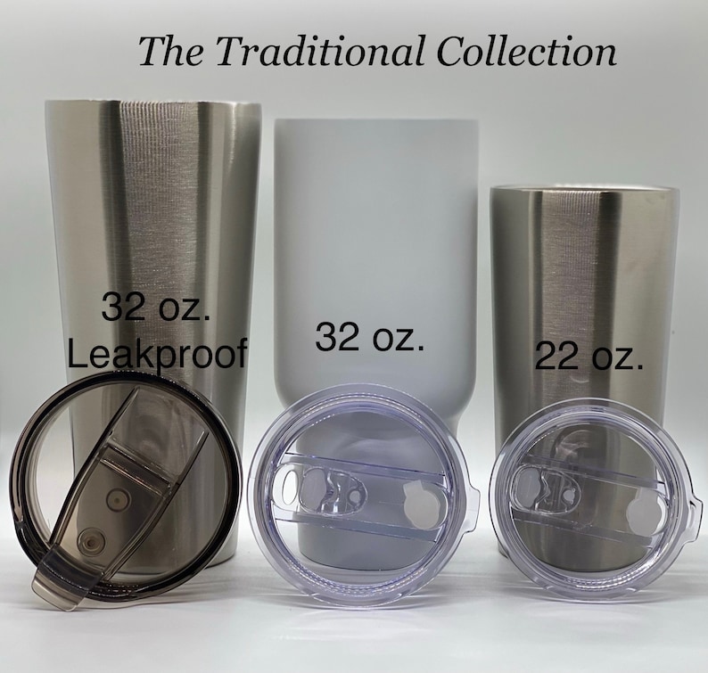 May include: Three stainless steel tumblers with lids. The tumblers are 32 oz, 32 oz, and 22 oz. The 32 oz tumblers are silver and white. The 22 oz tumbler is silver. The text "The Traditional Collection" is at the top of the image. The 32 oz silver tumbler has the text "32 oz. Leakproof".