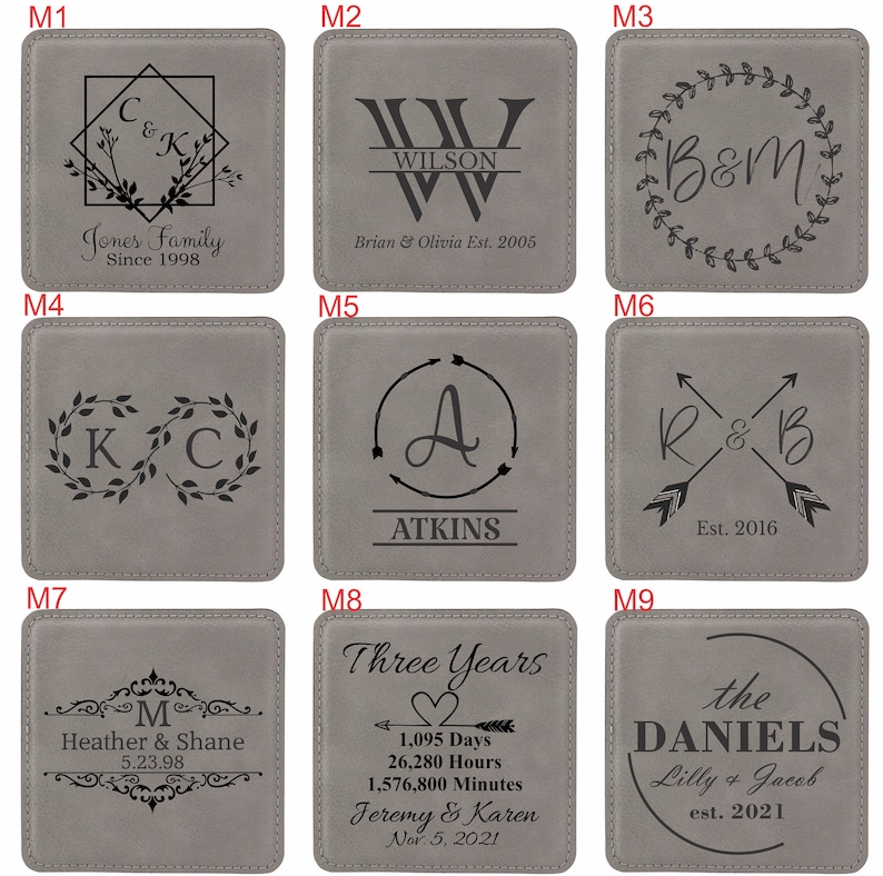 May include: A set of nine square grey coasters, each featuring unique black laser-engraved designs including monograms, names, dates, and decorative elements like wreaths, arrows, and geometric frames, labelled M1 through M9 for customisation.