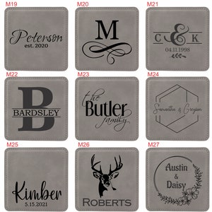 May include: A set of nine square grey coasters featuring various laser-engraved designs including names like Peterson, Bardsley, Butler, Kimber, Roberts, Austin, and Daisy, along with dates, monograms, a deer head, and floral wreath motifs.