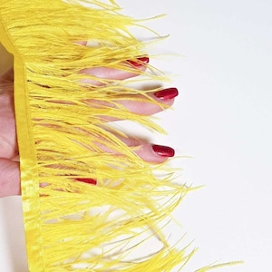 Yellow natural ostrich feathers on a ribbon, MC038