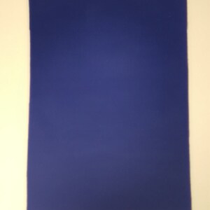 May include: A solid blue piece of felt fabric.