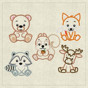 May include: Five embroidered patches featuring cartoon animals: a brown bear, a brown squirrel holding an acorn, a gray raccoon, a brown fox, and a brown reindeer. The patches are all in a cute, cartoon style.