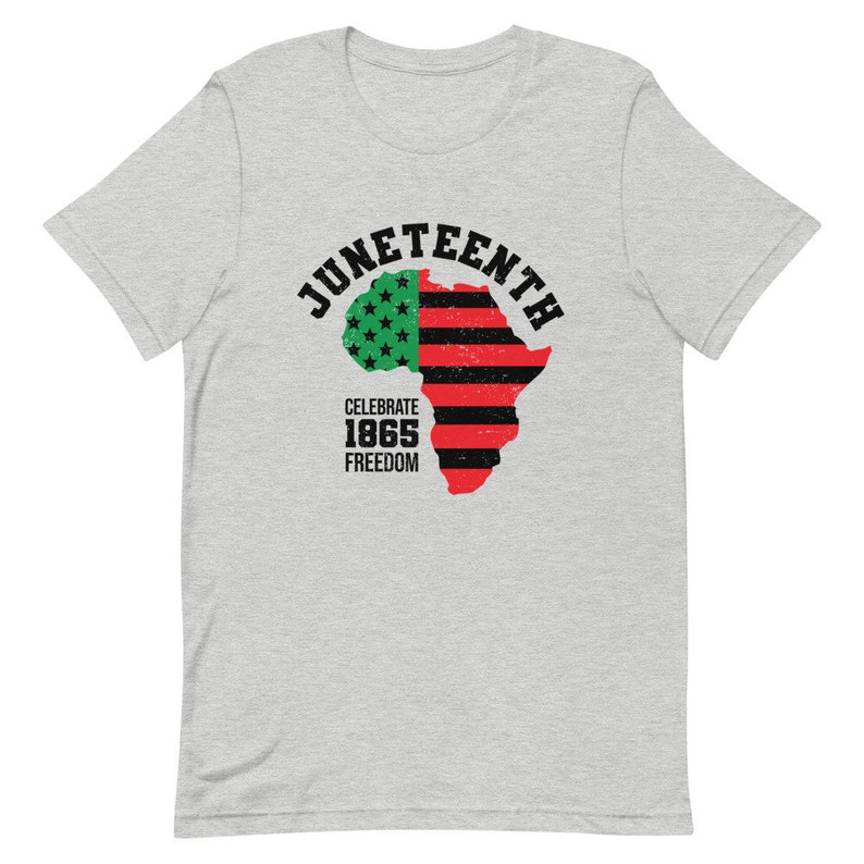 May include: A grey t-shirt with a graphic design of a red, black, and green outline of the continent of Africa. The graphic also includes the words "Juneteenth", "Celebrate 1865", and "Freedom".