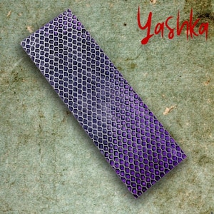 May include: A set of three ceramic mugs with a speckled, matte finish. The mugs are in shades of cream, light gray, and dark gray. Each mug has a simple, minimalist design and a rounded handle.