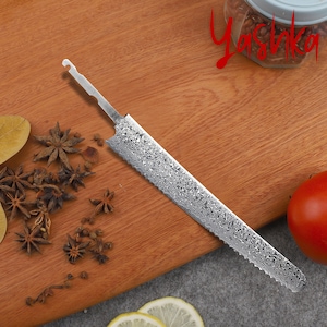 May include: A silver serrated knife with a textured blade and a small hook at the top of the handle. The knife is lying on a wooden cutting board with star anise and other spices scattered around it.