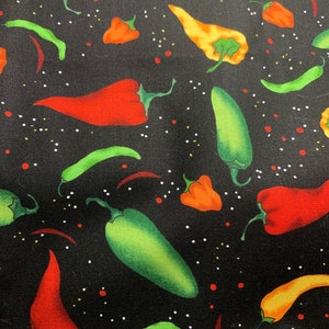 May include: A black fabric featuring a repeating pattern of various chili peppers in shades of red, orange, yellow, and green. The design is accented with small white and red dots scattered across the dark background, creating a vibrant culinary print.
