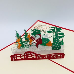 Kerstman op de fiets, Kerstman met zijn fiets, pop-up kaart, kerstkaart, 3D kaarten, kerstkaarten
