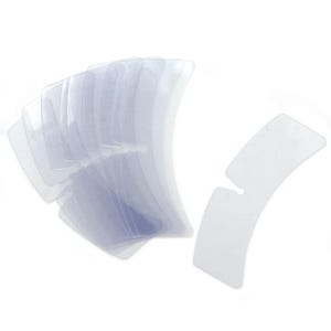 May include: A collection of clear, curved plastic face tape strips. The strips are arranged in a fan shape, with one strip separated from the others. The strips have a slightly curved shape with a small cutout.