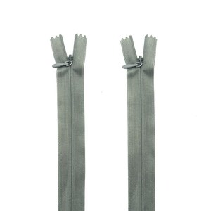 May include: Two gray invisible zippers are displayed against a white background. Each zipper is closed, showing the slider and teeth. The zippers are made of a fine, woven material, and are designed to be hidden in a garment's seam.