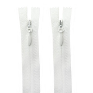 May include: Two white invisible zips are shown against a white backdrop. The zips have a delicate, streamlined design, with a small, teardrop-shaped pull tab. The zip tape has a subtle, textured appearance.