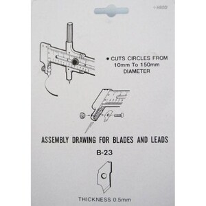 May include: A white card with illustrations and text for a circle cutter. The text reads "CUTS CIRCLES FROM 10mm TO 150mm DIAMETER" and "ASSEMBLY DRAWING FOR BLADES AND LEADS B-23". The thickness is 0.5mm.