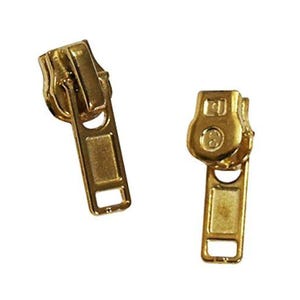 May include: Two gold-colored zipper pulls. The pulls are made of metal and have a rectangular shape with a hole at the bottom. The zipper pulls are designed to slide along a zipper track to open and close garments or other items.
