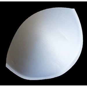 May include: A single, pale blue bra cup insert, with a curved design. The insert is made of a soft, textured material and is set against a black background. The overall shape is a rounded triangle.