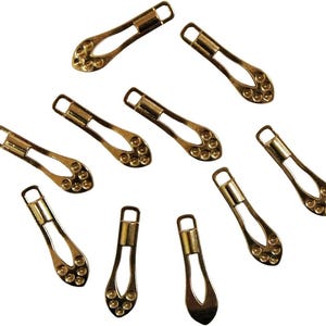 Ritssluitingtrekkers, labels, sluitingen, druppelvormig, 182 stuks, zilver of goud - verpakking van 10