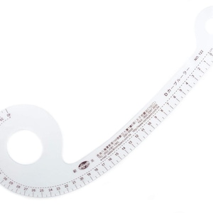 May include: A clear, curved plastic sewing ruler featuring a circular cutout and black printed metric markings from 1 to 40 cm. The tool is labelled with the text Dカーブルーラー and NO. 122, along with contact information for the manufacturer.