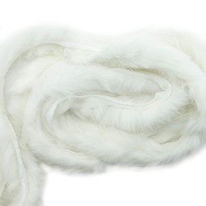 May include: A white faux fur trim, perfect for adding a touch of luxury to clothing or crafts.