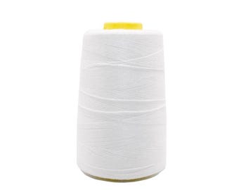 May include: A large spool of white thread with a yellow top. The thread is tightly wound around a cylindrical core, creating a cone shape. The image is against a white background.