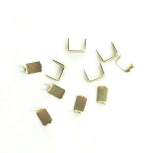 A Set of 10 No.5 Brass Bottom Zip Stops Ends