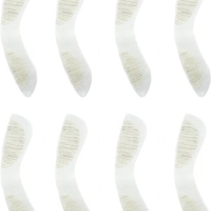 Könnte beinhalten: Acht weiße Klebepads mit einer strukturierten Oberfläche. Die Pads sind halbmondförmig und für verschiedene Zwecke konzipiert.