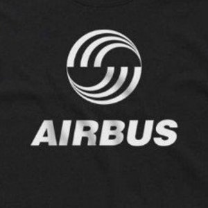 May include: A black t-shirt with a white graphic of the Airbus logo. The logo is a circle with three white curved lines inside. The word "AIRBUS" is printed in white below the logo.