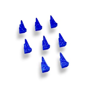 May include: Eight blue glitter state of Vermont shaped ornaments. The ornaments are a dark blue color with a glittery finish.