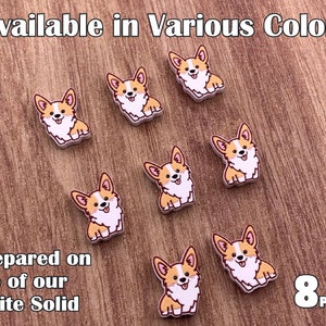 May include: Eight cartoon corgi dog stickers, available in various colors. The stickers are prepared on top of our white solid surface.