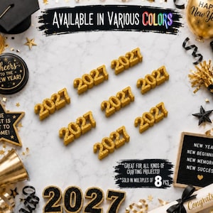 May include: Multiple gold glittery 2027 year cutouts arranged on a white surface. The image includes text that reads AVAILABLE IN VARIOUS COLORS, GREAT FOR ALL KINDS OF CRAFTING PROJECTS, SOLD IN MULTIPLES OF 8 PCS, and NEW YEAR NEW BEGINNINGS.