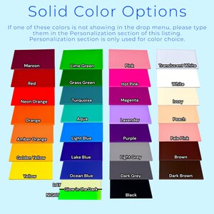 a group of different colors of paper on a blue background