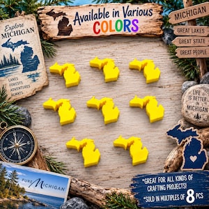 May include: Eight bright yellow, flat, Michigan-shaped cutouts arranged in a grid. The scene includes a compass, a sign reading Available in Various COLORS, a sign reading Explore MICHIGAN, a sign reading LIFE IS BETTER IN MICHIGAN, and a sign reading GREAT FOR ALL KINDS OF CRAFTING PROJECTS! SOLD IN MULTIPLES OF 8 PCS.