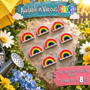 Peut inclure: Sept cabochons en forme de demi-cercle aux couleurs de l'arc-en-ciel avec des bandes concentriques rouges, orange, jaunes, vertes, bleues et violettes. Le texte sur l'image indique Available in Various COLORS et Great for all kinds of crafting projects! Sold in multiples of 8 pcs.