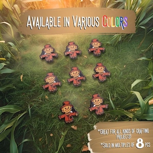 May include: Wooden scarecrow embellishments in various colors, arranged on a grassy surface. Each scarecrow has a red outfit and a hat. The image includes text that says "AVAILABLE IN VARIOUS COLORS" and "GREAT FOR ALL KINDS OF CRAFTING PROJECTS!" and "SOLD IN MULTIPLES OF 8 PCS".
