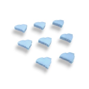 May include: Eight light blue heart-shaped ice molds on a white background.