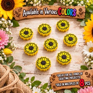 May include: Eight yellow sunflower-shaped buttons with black centers arranged on a wooden surface. A wooden sign at the top reads Available in Various COLORS and a sign at the bottom reads GREAT FOR ALL KINDS OF CRAFTING PROJECTS! SOLD IN MULTIPLES OF 8 PCS