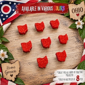 May include: Eight small, red, glittery, Ohio-shaped cutouts arranged on a wooden surface. The image includes text that reads: Available in various colors, Ohio, Home Grown, Great for all kinds of crafting projects, and Sold in multiples of 8 pcs.