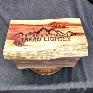 Item 882 - Aromatic cedar chest/box with mountains and unique &quot;tread lightly&quot; woodburning on lid