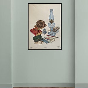May include: A vintage still life illustration featuring a blue glass oil lamp, a red leather-bound journal, a brass letter opener, a small glass bottle, and a stack of envelopes and postcards. The illustration is titled "Exquisite".
