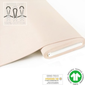 Op de afbeelding: Een rol crèmekleurige interlock gebreide stof gemaakt van 100% katoen. De stof is gecertificeerd volgens Oeko-Tex Standard 100 en Global Organic Textile Standard (GOTS).