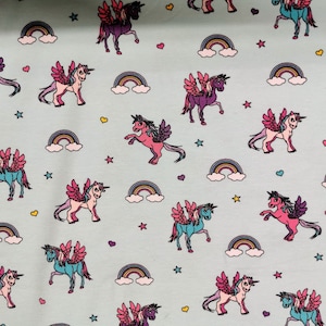 Stretch Jersey Unicorns Starburst Unicorn by Puppy on light turquoise