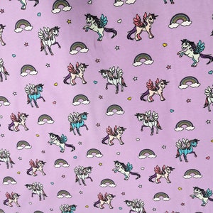 Stretch Jersey Unicorns Starburst Unicorn by Puppy on light purple lilac