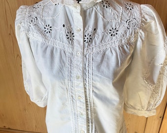 Romantic blouse with embroidery sewn from tablecloth