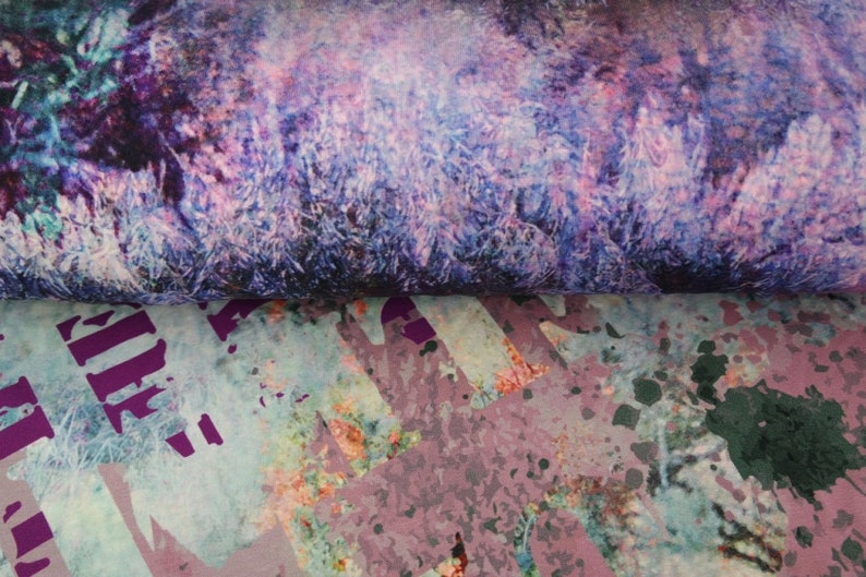 May include: Purple and blue abstract print fabric with a splatter paint design in shades of pink, green, and black.