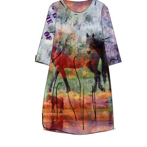 May include: A colourful dress with a watercolour-like print of horses in a field. The dress has a round neckline and 3/4 sleeves.