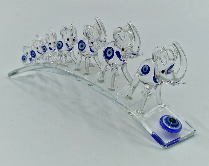 Glass elephants on a bridge