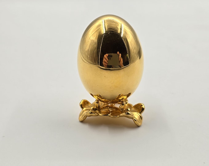 Gilded egg on stand, marked "Risis"