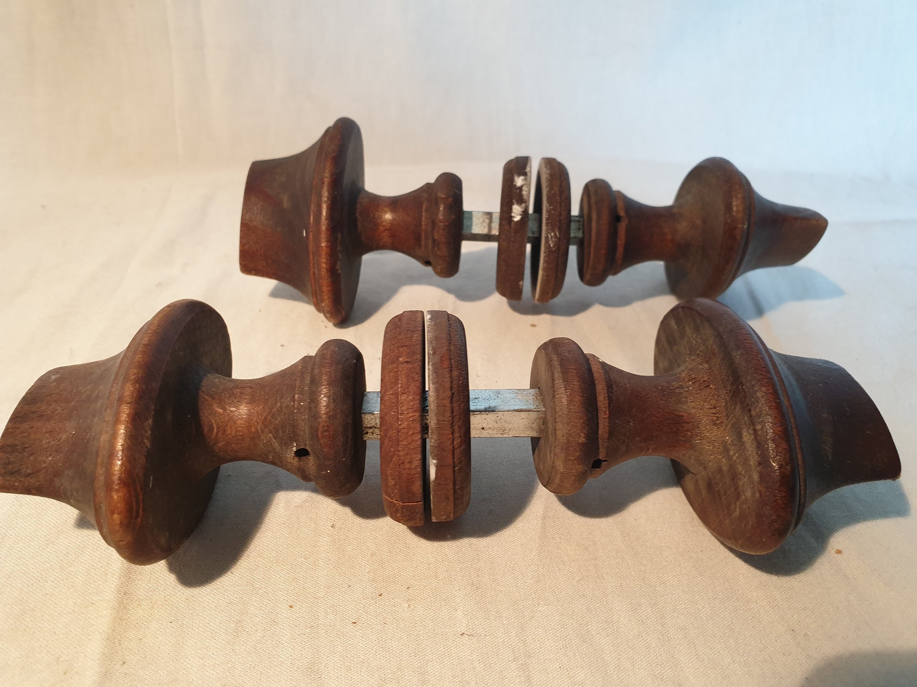 Set of two antique wooden door handles, complete with rosettes