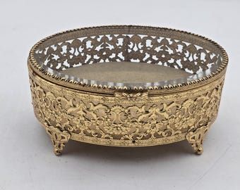 Large oval trinket box, openwork cut, facet-cut lid