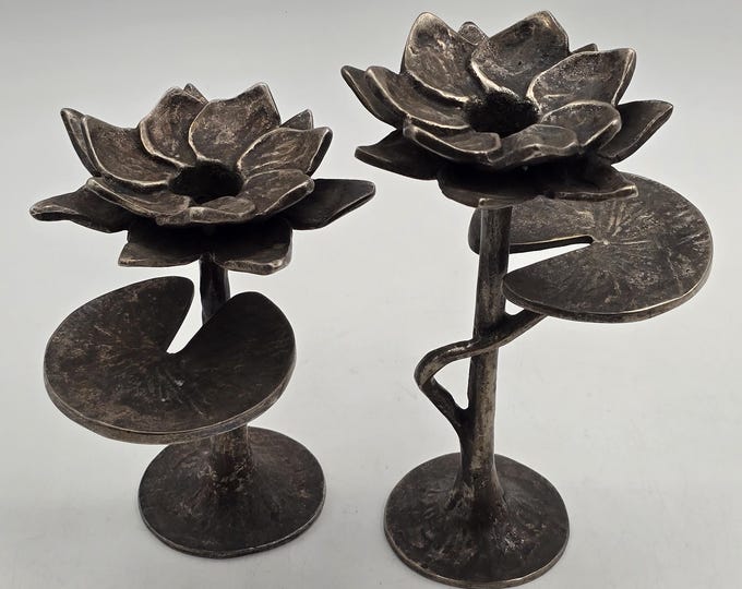 Pair of bronze candlesticks in the shape of a lily
