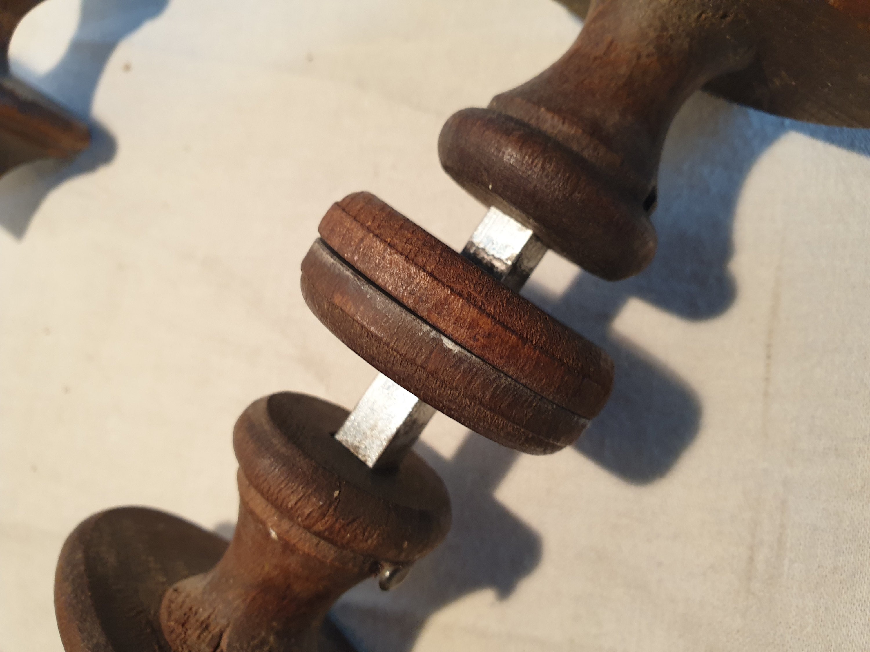 Set of two antique wooden door handles, complete with rosettes