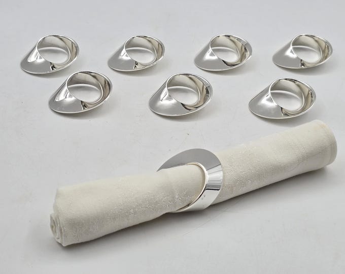 Set of 8 designer napkin rings, marked Philippi